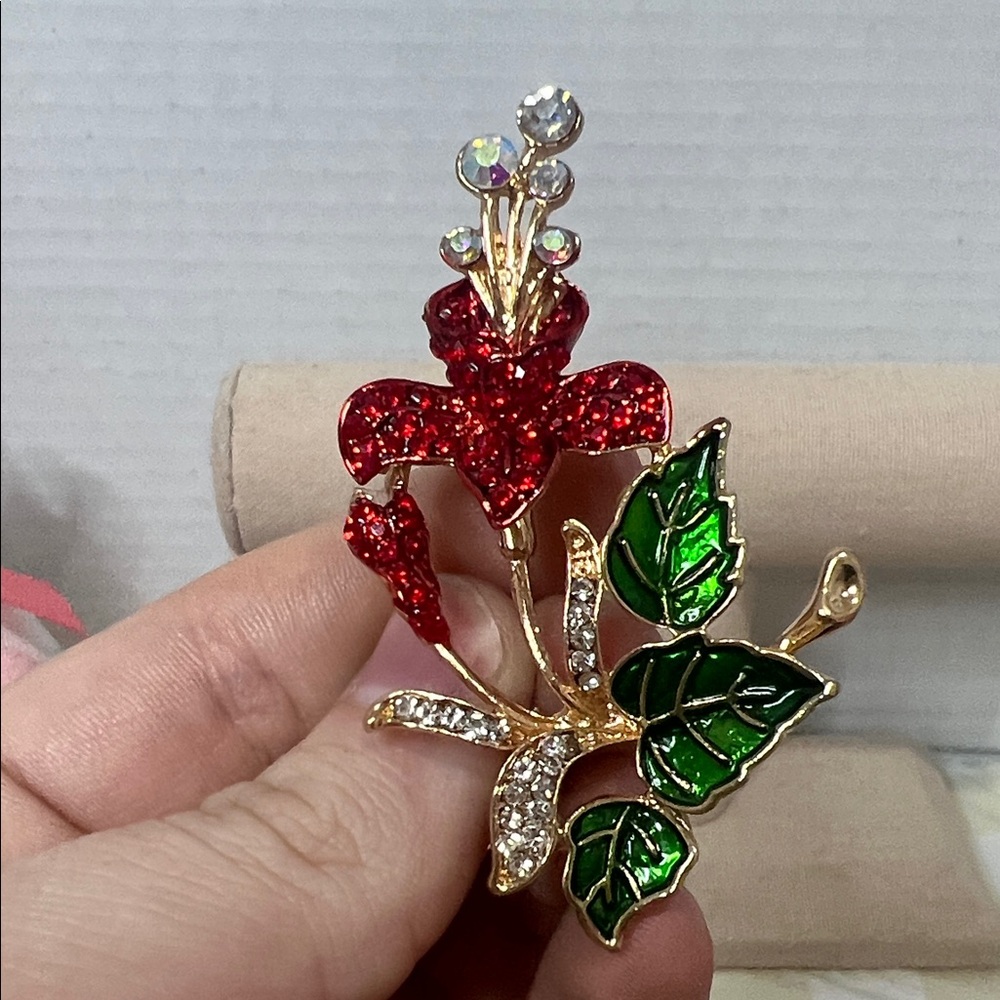 Gold-Tone Red Crystal Floral Brooch with Green Enamel Leaves